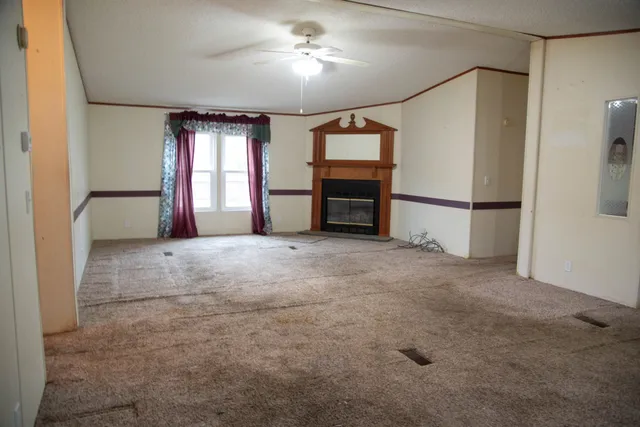 a kitchen with stainless steel appliances wooden floor and more cabinets