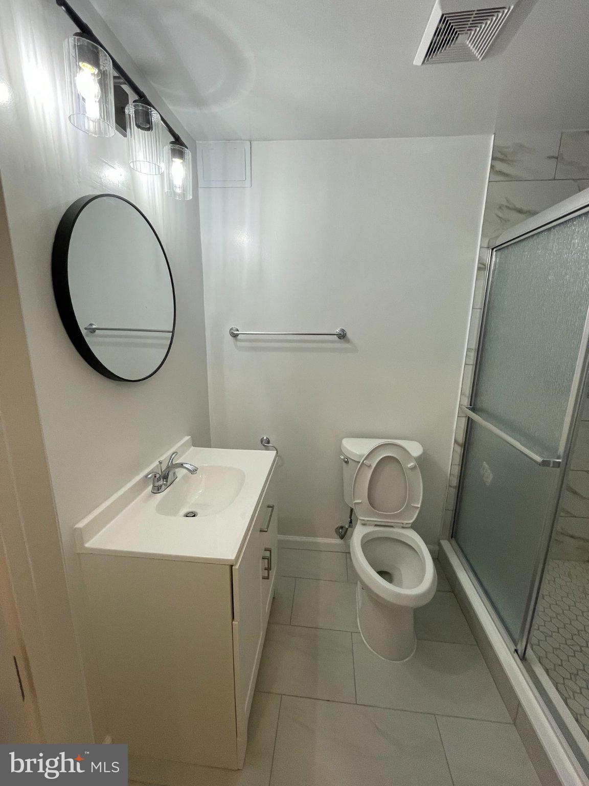 2016 Gatewood Place Silver Spring, MD 20903 - Photo 21 of 24 a bathroom with a sink toilet and a mirror
