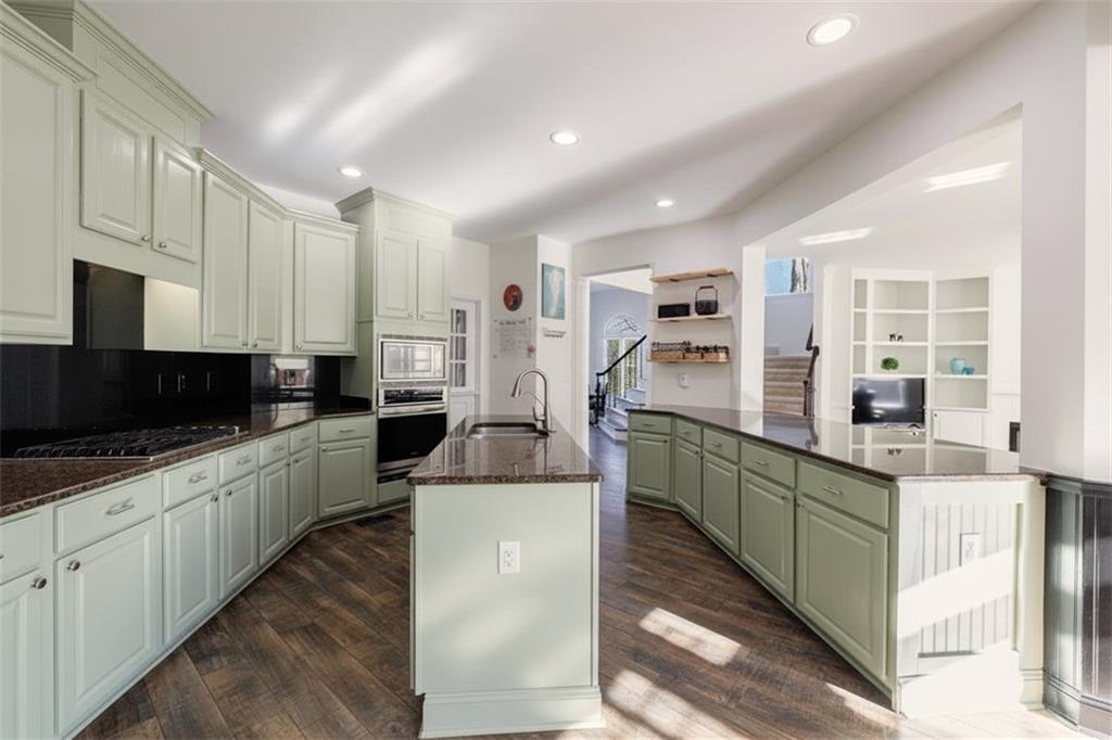6010 Masters Club Drive Suwanee, GA 30024 - Photo 15 of 82 a large kitchen with stainless steel appliances lots of counter top space