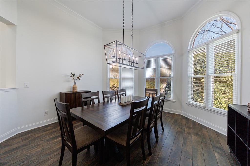 6010 Masters Club Drive Suwanee, GA 30024 - Photo 5 of 82 a view of a dining room with furniture window and wooden floor