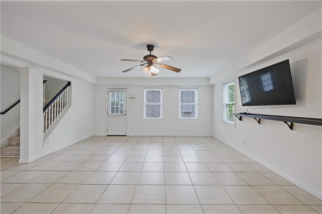 6010 Masters Club Drive Suwanee, GA 30024 - Photo 51 of 82 a view of a livingroom with furniture and a flat screen tv