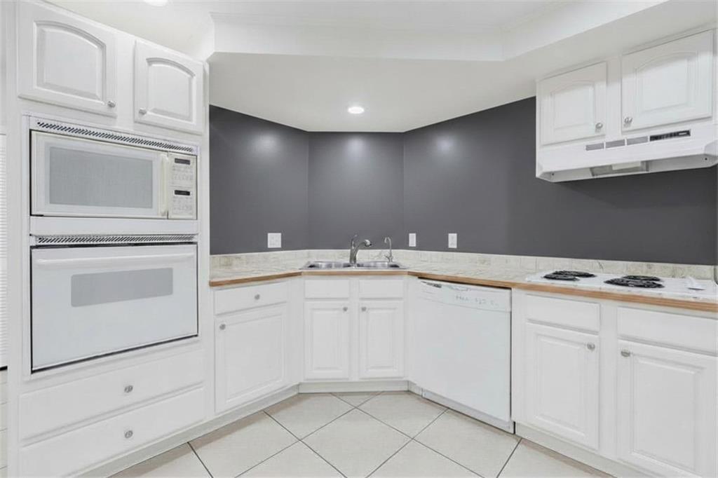 6010 Masters Club Drive Suwanee, GA 30024 - Photo 57 of 82 a bathroom with cabinets stainless steel appliances and sink