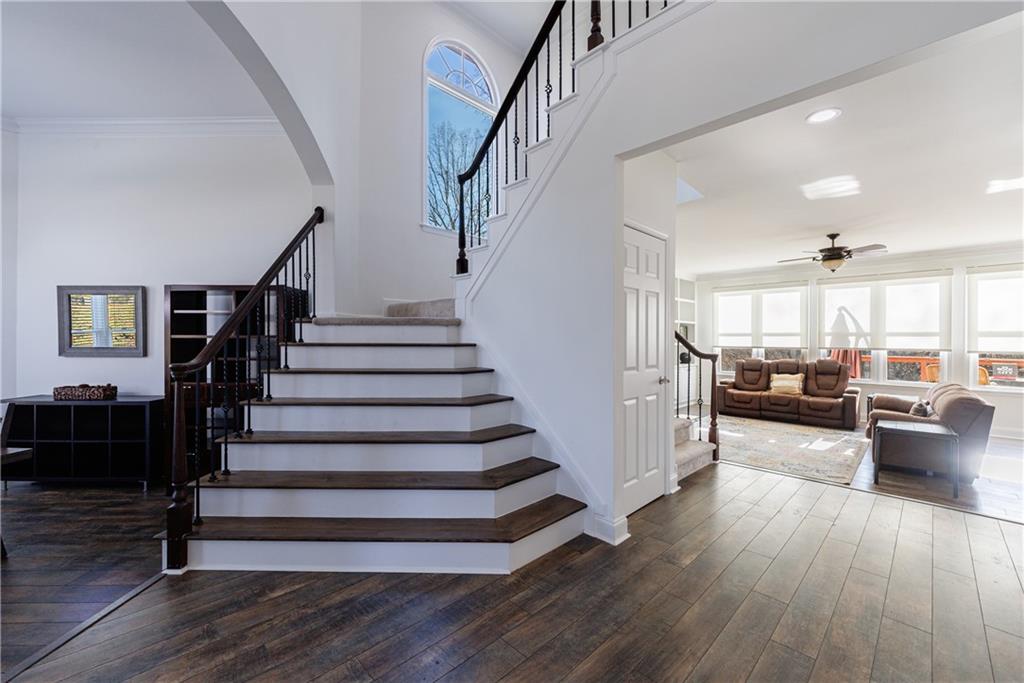 6010 Masters Club Drive Suwanee, GA 30024 - Photo 6 of 82 a view of entryway and hall with wooden floor