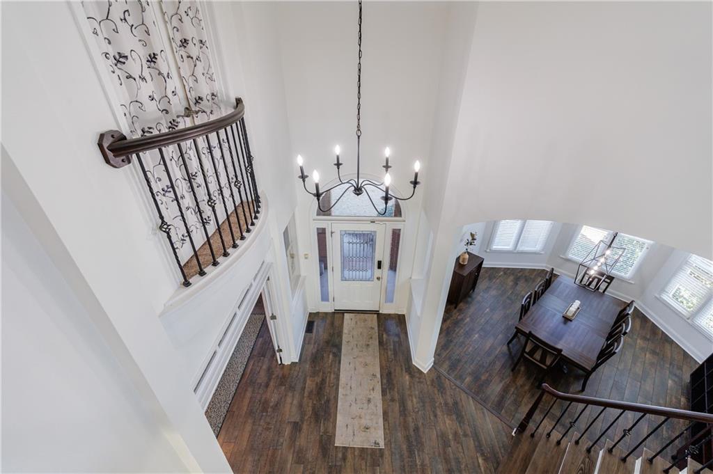 6010 Masters Club Drive Suwanee, GA 30024 - Photo 7 of 82 a view of a dining room with furniture and wooden floor
