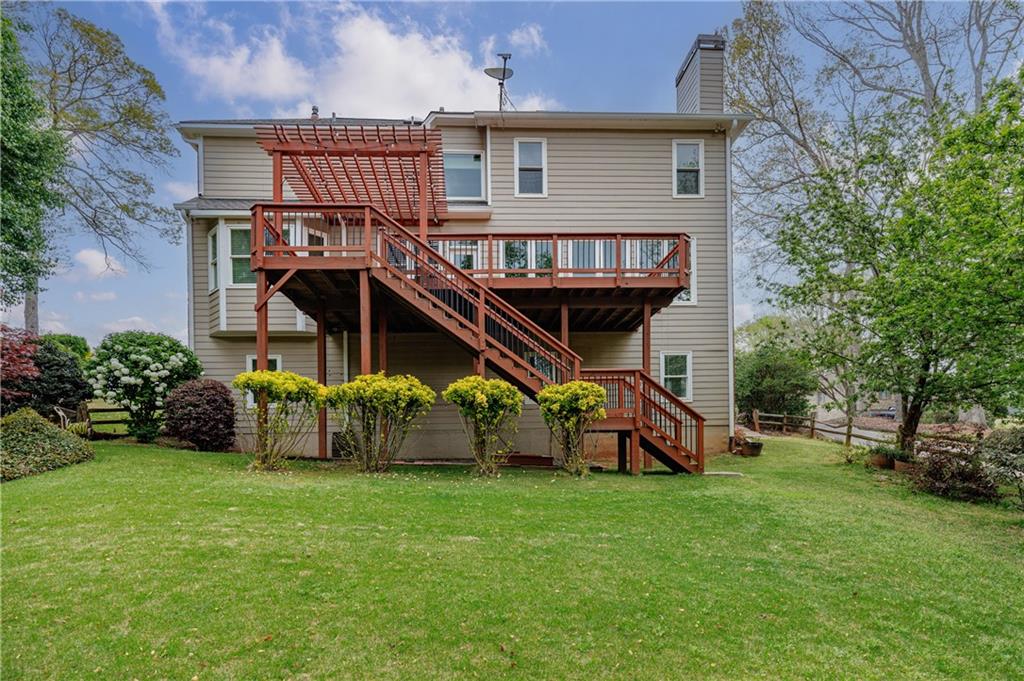 6010 Masters Club Drive Suwanee, GA 30024 - Photo 71 of 82 a view of a house with a yard