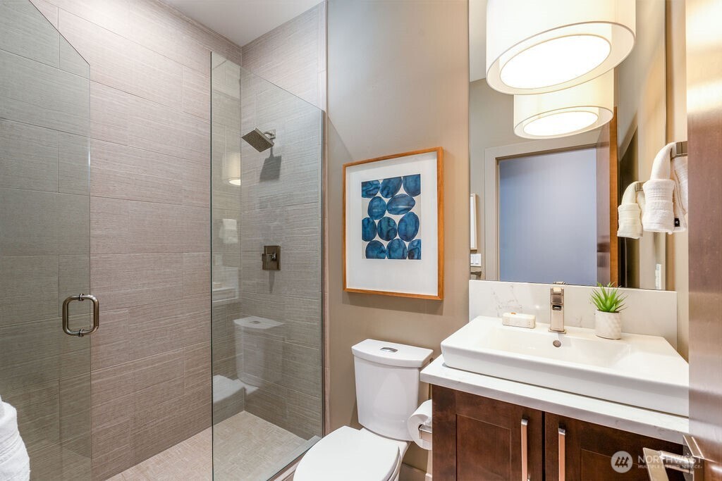 205 4th Court South, Unit 13 Kirkland, WA 98033 - Photo 11 of 33 a bathroom with a sink toilet and shower