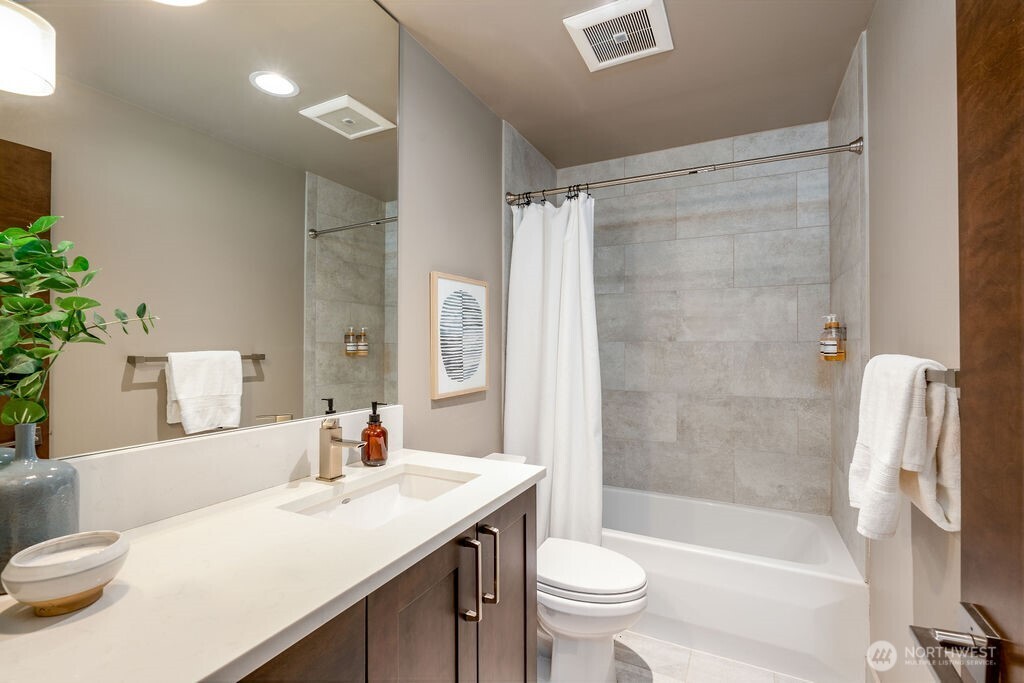 205 4th Court South, Unit 13 Kirkland, WA 98033 - Photo 12 of 33 a bathroom with a sink toilet and shower