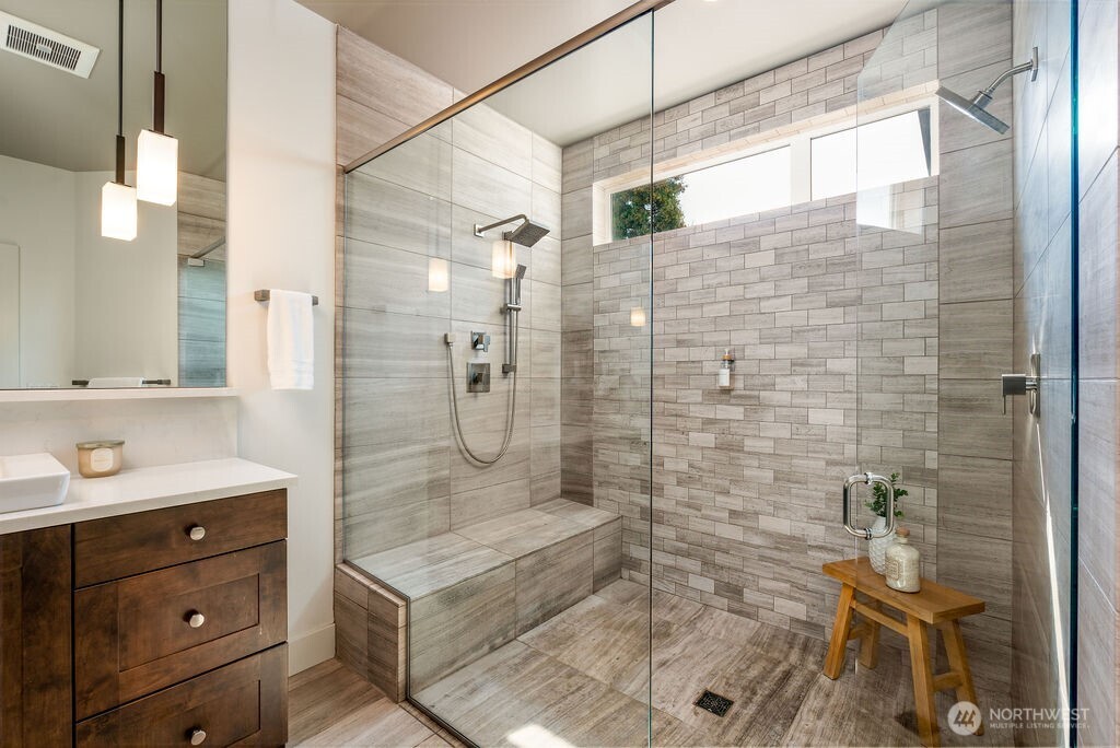 205 4th Court South, Unit 13 Kirkland, WA 98033 - Photo 22 of 33 a bathroom with a shower sink and mirror