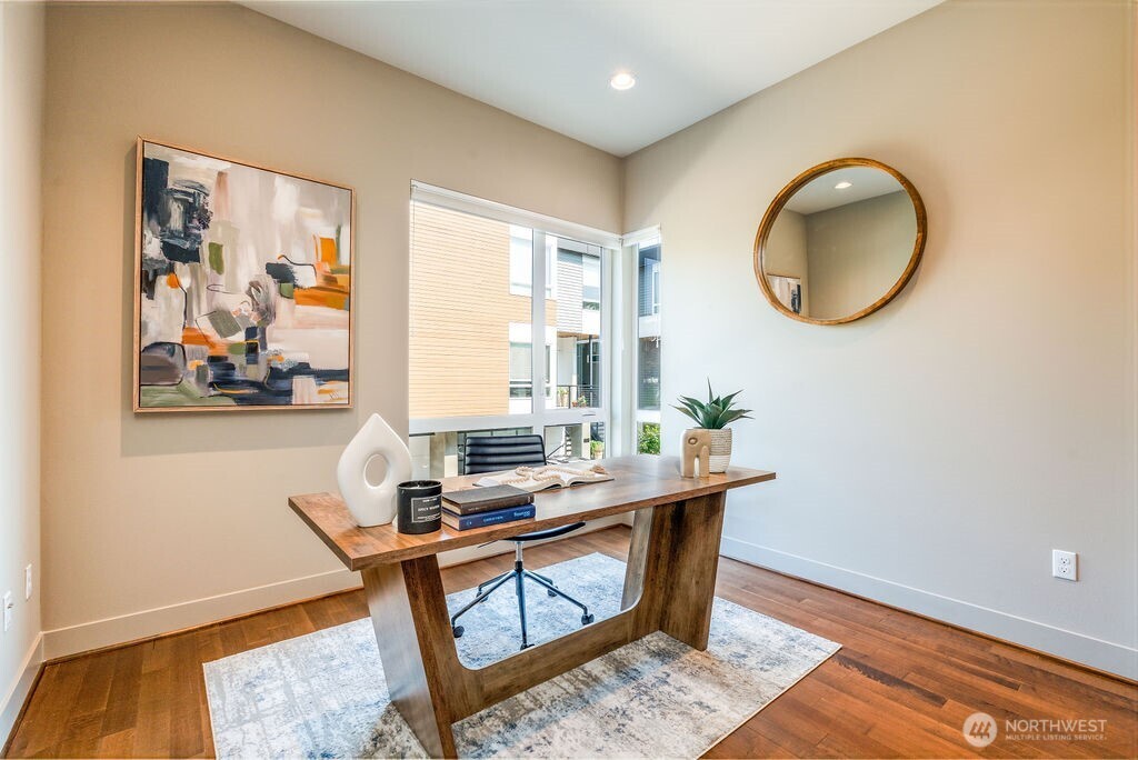 205 4th Court South, Unit 13 Kirkland, WA 98033 - Photo 25 of 33 a room with table and mirror