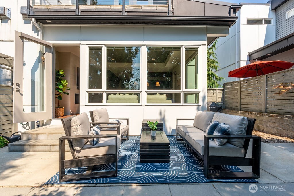 205 4th Court South, Unit 13 Kirkland, WA 98033 - Photo 28 of 33 an outdoor living area with furniture and a window