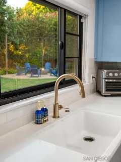 a kitchen with a sink stove and microwave