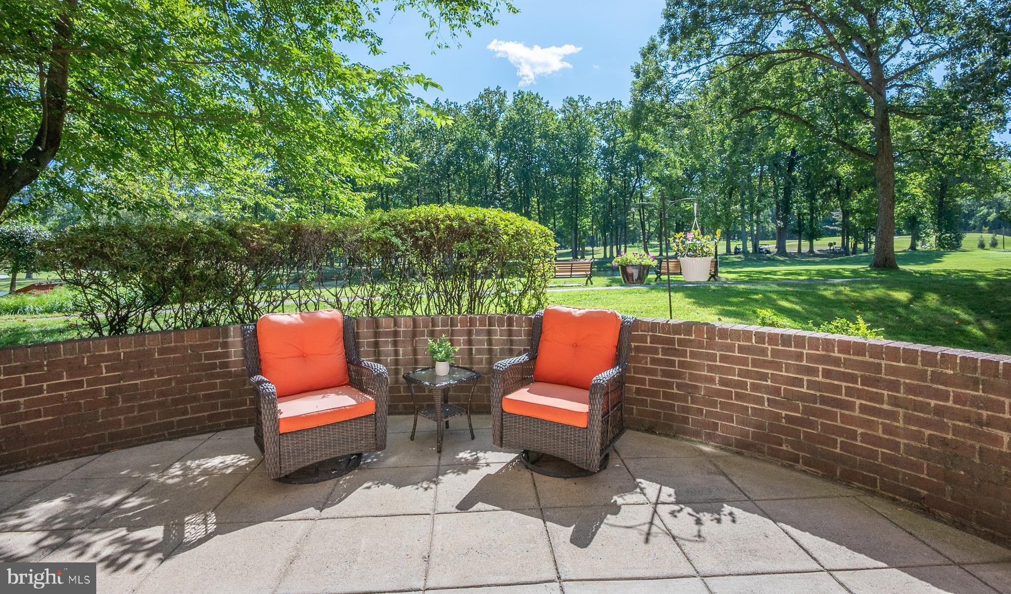 a view of yard with seating area and green space