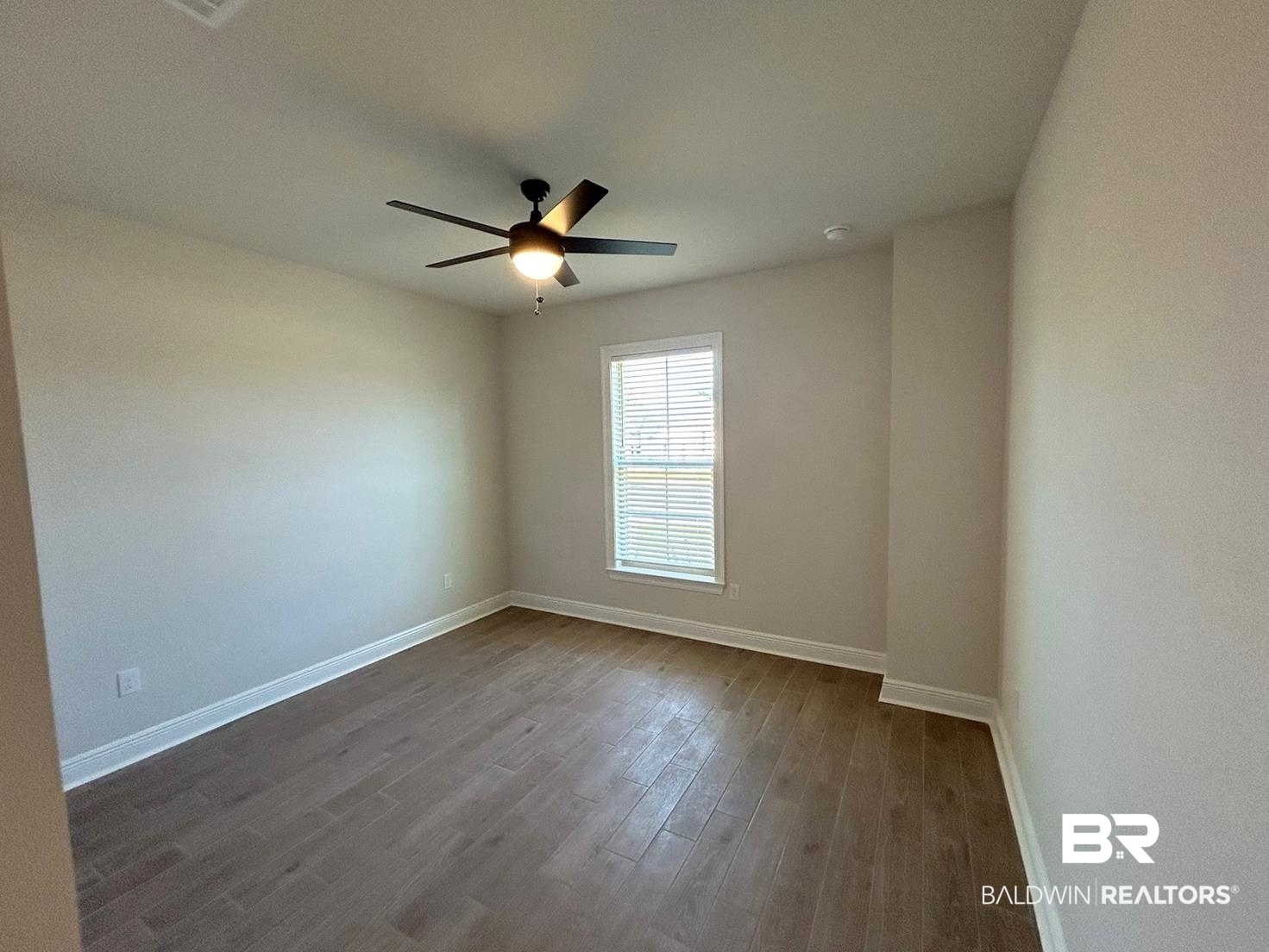 872 Sumter Loop Foley, AL 36535 - Photo 13 of 18 Unfurnished room featuring hardwood / wood-style floors and ceiling fan