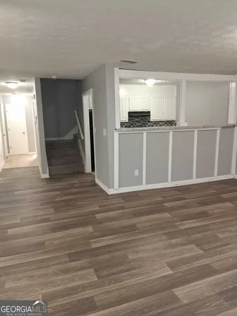 a view of a kitchen from the hallway