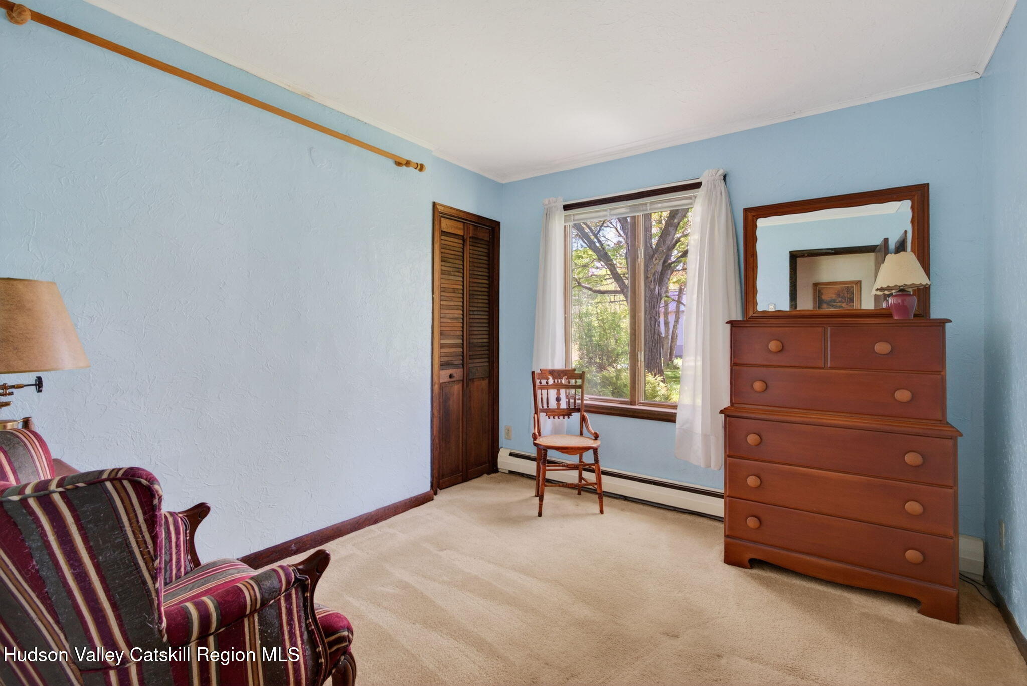 689 Old Road Windham, NY 12496 - Photo 17 of 42 a room with a dresser and a window