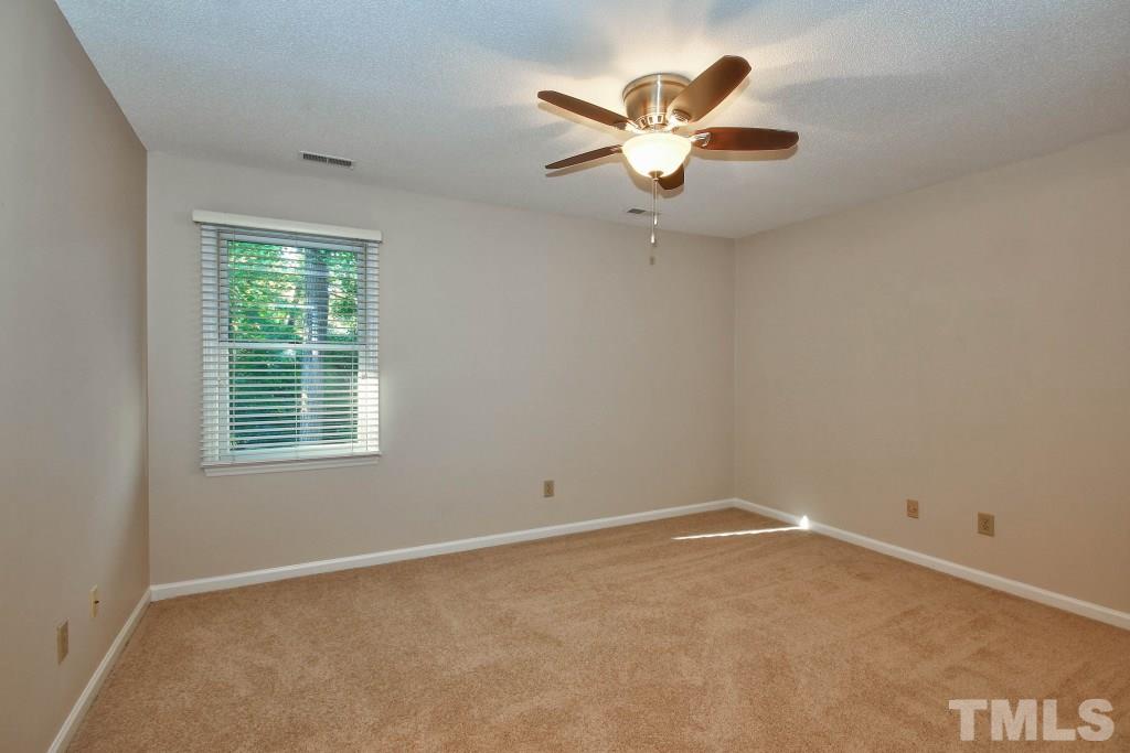 5512 Hamstead Crossing Raleigh, NC 27612 - Photo 11 of 16 an empty room with a window