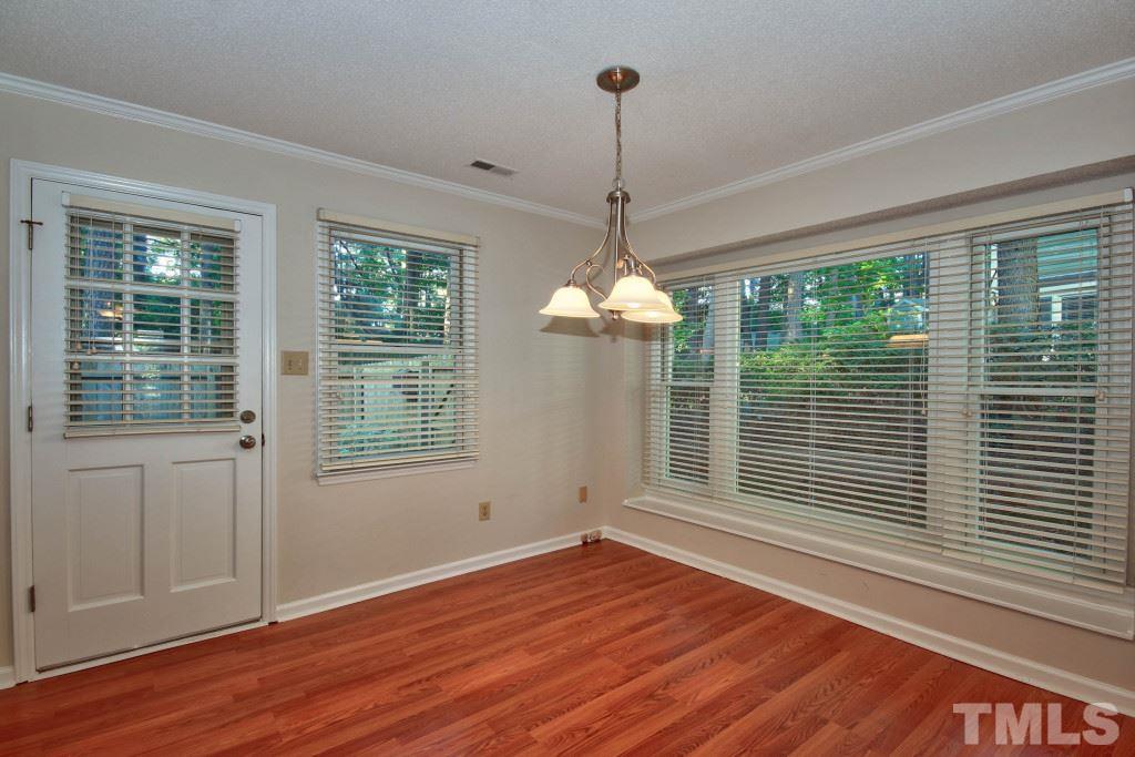 5512 Hamstead Crossing Raleigh, NC 27612 - Photo 6 of 16 a view of empty room with wooden floor and windows