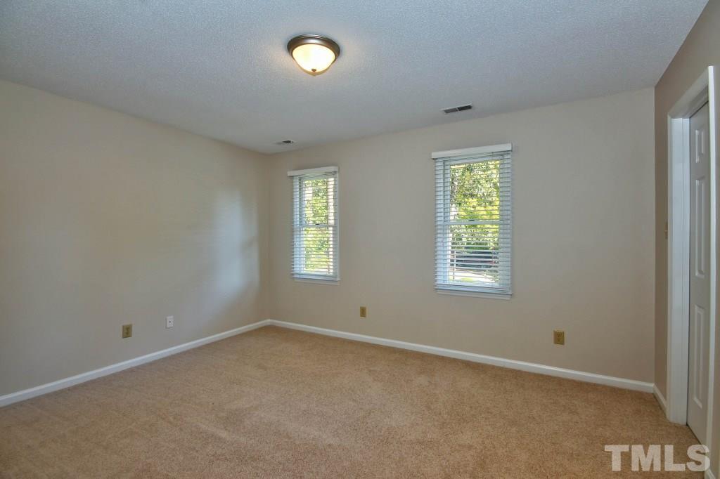 5512 Hamstead Crossing Raleigh, NC 27612 - Photo 8 of 16 an empty room with windows