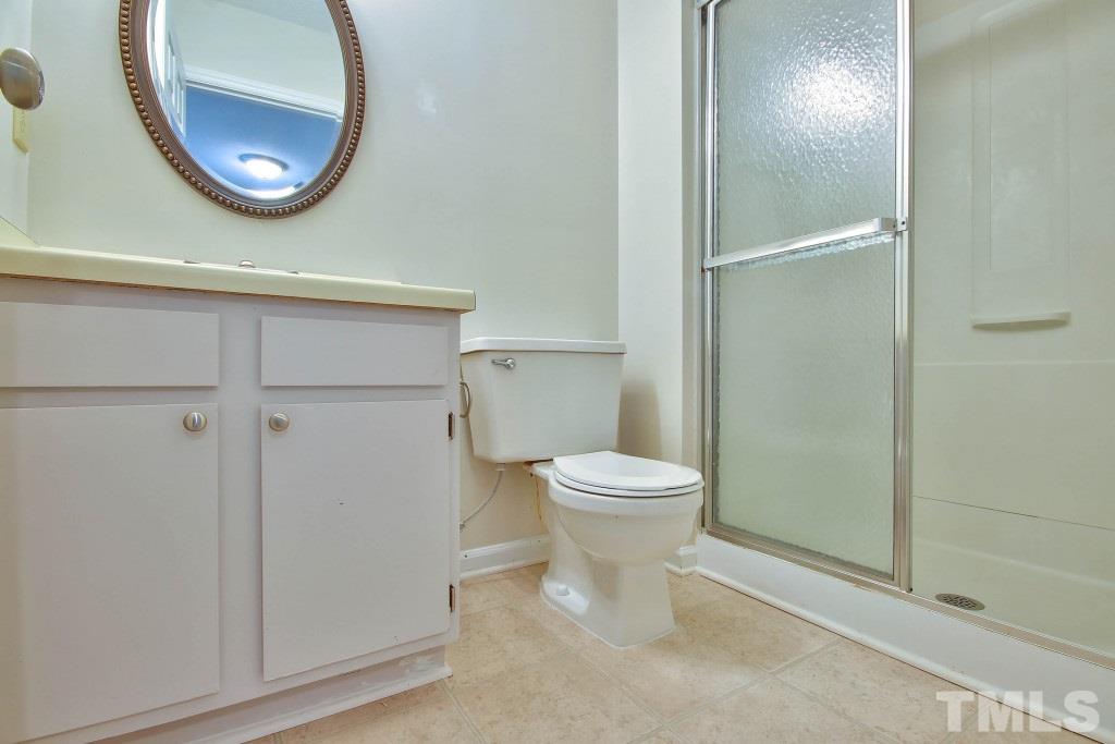 5512 Hamstead Crossing Raleigh, NC 27612 - Photo 10 of 16 a bathroom with a toilet and a mirror