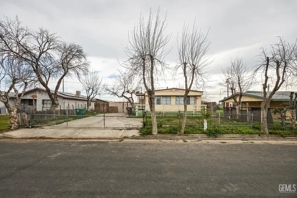 a view of road with house in the background