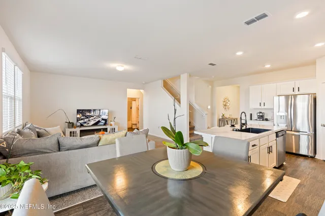 a kitchen with a table and chairs