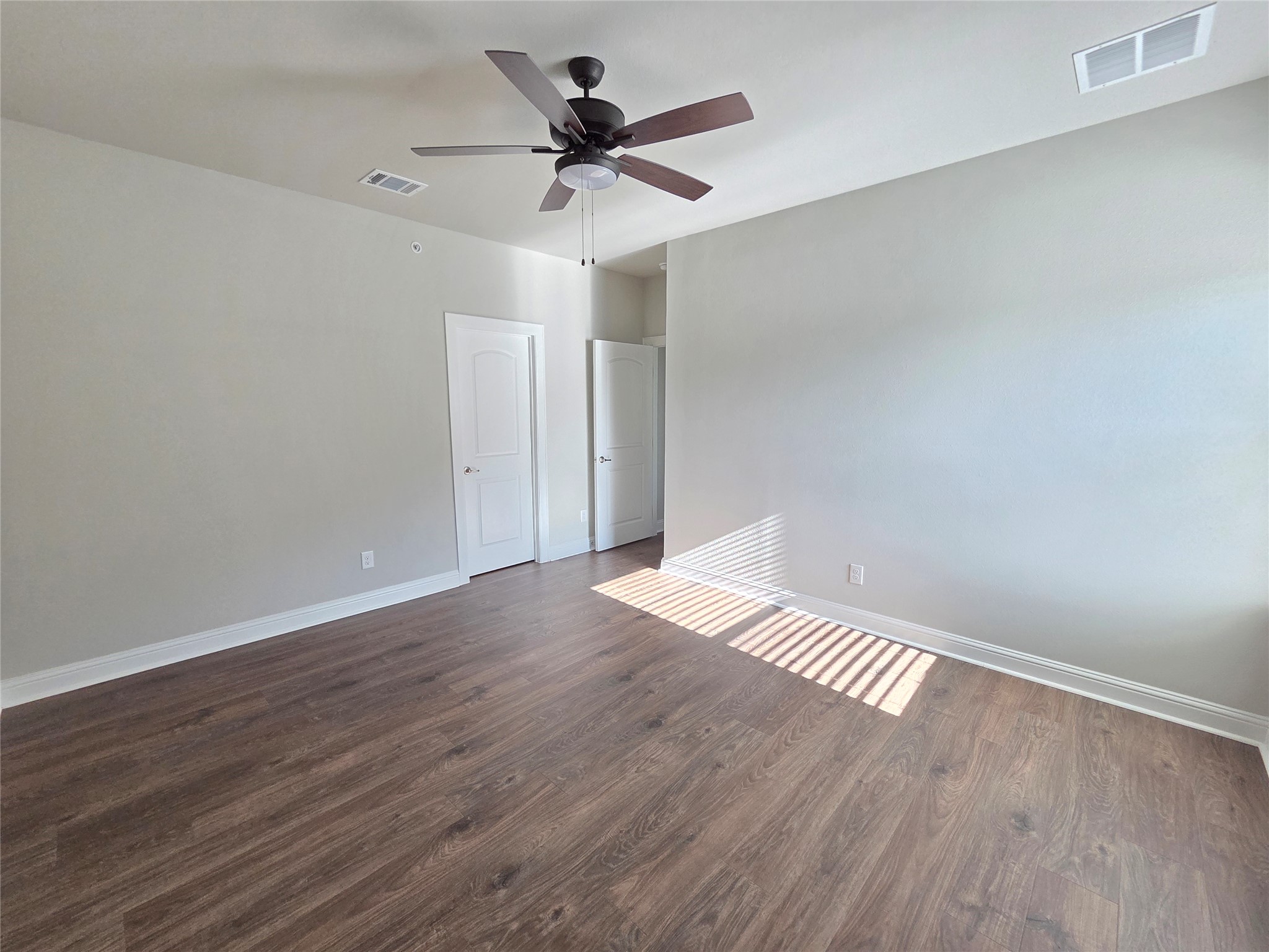 600 C-Bar Ranch Trail, Unit 121 Cedar Park, TX 78613 - Photo 28 of 32 Rich hardwood-style flooring and a ceiling fan enhance this inviting interior space.