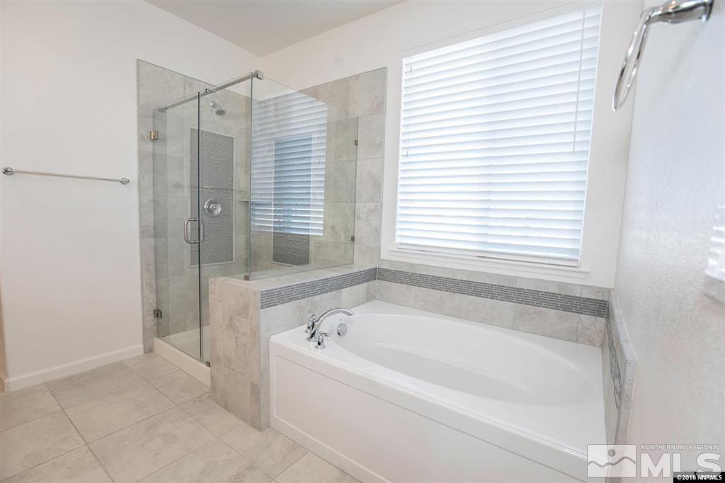 1917 Wind Walker Drive Reno, NV 89521 - Photo 5 of 14 a bathroom with a bathtub and shower