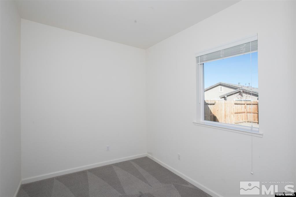 1917 Wind Walker Drive Reno, NV 89521 - Photo 6 of 14 an empty room with a window