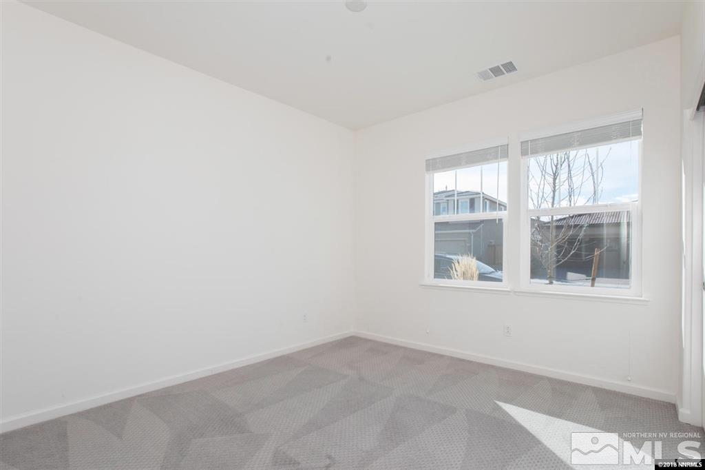 1917 Wind Walker Drive Reno, NV 89521 - Photo 7 of 14 an empty room with windows