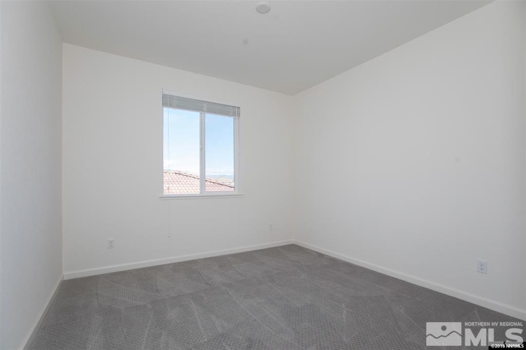 1917 Wind Walker Drive Reno, NV 89521 - Photo 10 of 14 an empty room with a window