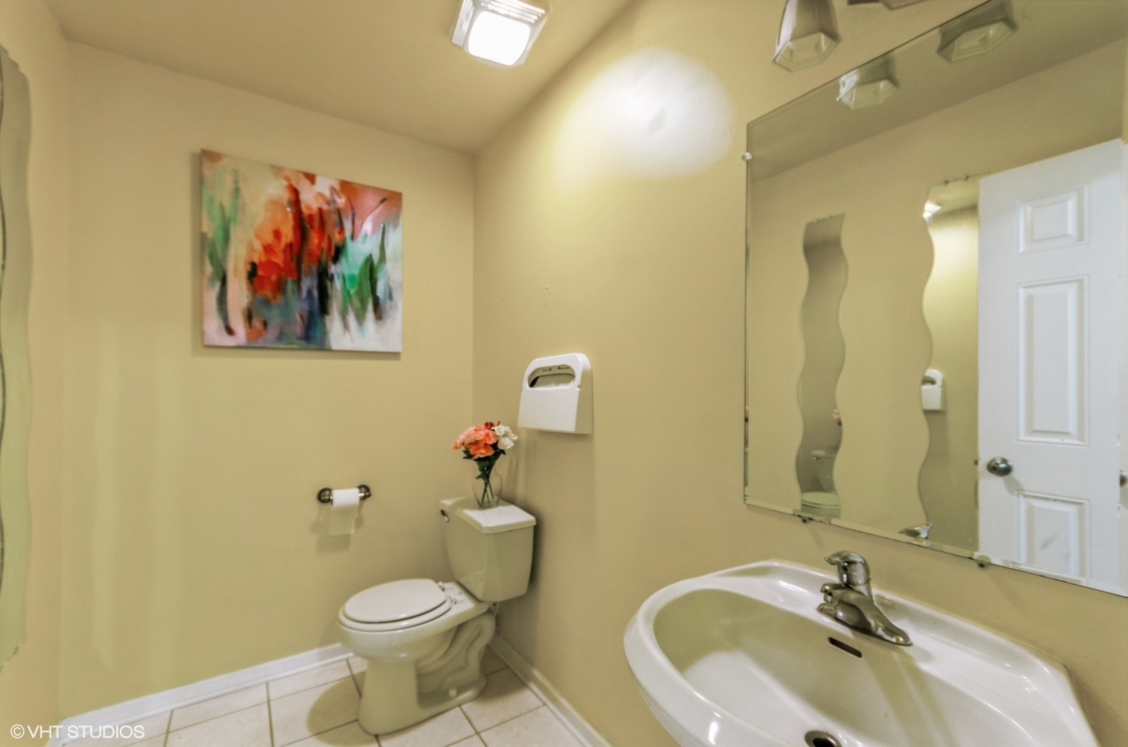 1334 West 98th Street Chicago, IL 60643 - Photo 4 of 15 a bathroom with a toilet sink and mirror