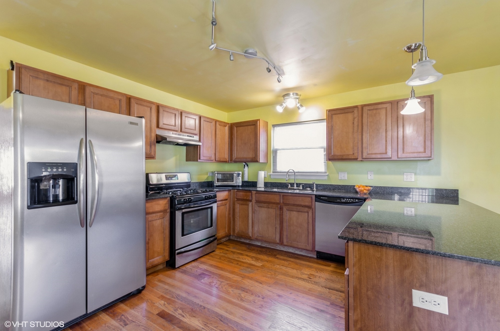 1334 West 98th Street Chicago, IL 60643 - Photo 5 of 15 a kitchen with stainless steel appliances granite countertop a refrigerator a sink dishwasher a stove with wooden cabinets and floor