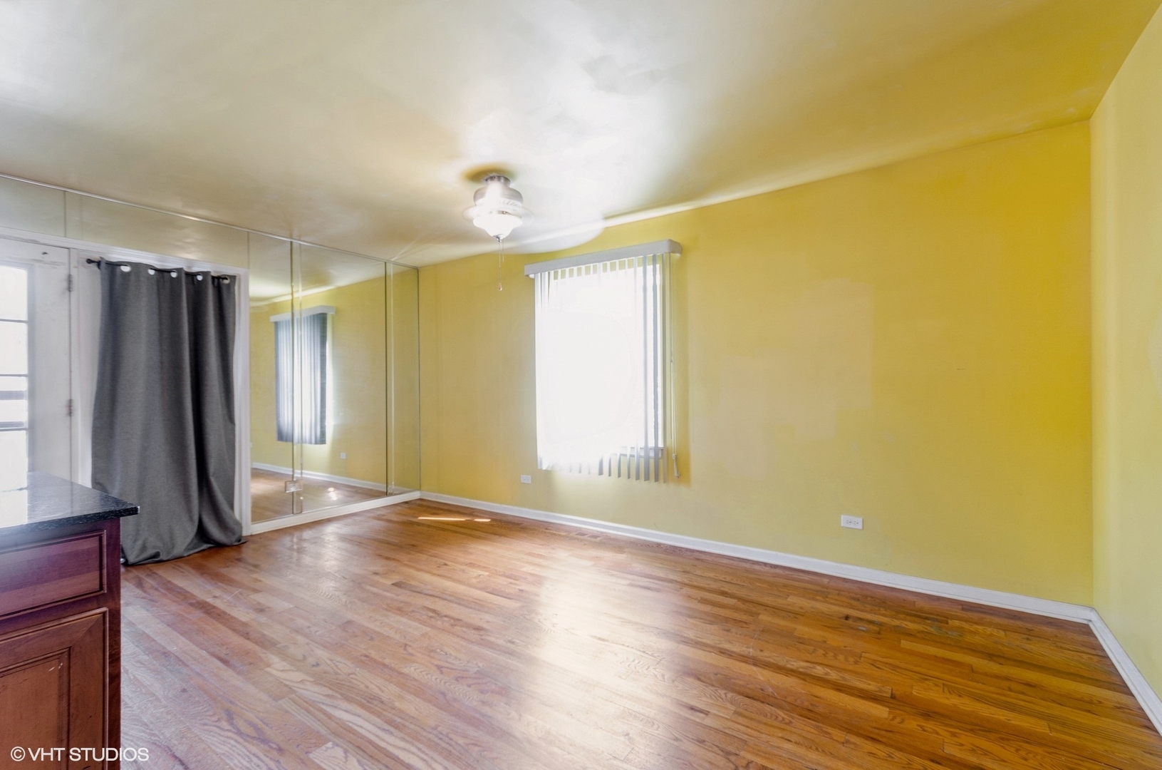 1334 West 98th Street Chicago, IL 60643 - Photo 6 of 15 a view of a livingroom with wooden floor and a window
