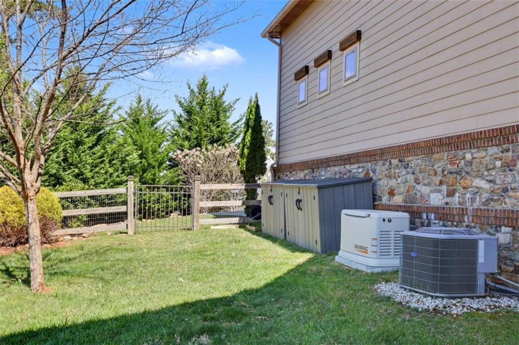 899 Ridge Pointe Way Blairsville, GA 30512 - Photo 72 of 88 a backyard of a house with table and chairs