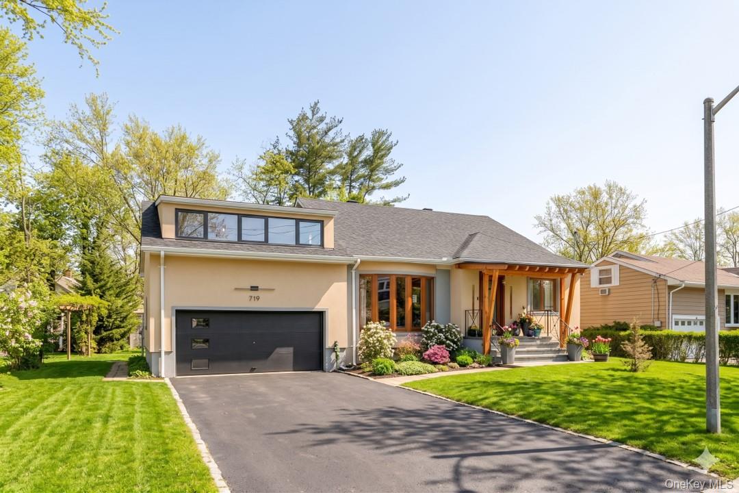 719 Wilmot Road Scarsdale, NY 10583 - Photo 2 of 28 a view of a house with a yard and furniture