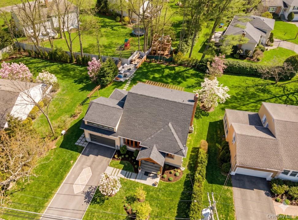 719 Wilmot Road Scarsdale, NY 10583 - Photo 3 of 28 an aerial view of a house with a yard basket ball court and outdoor seating