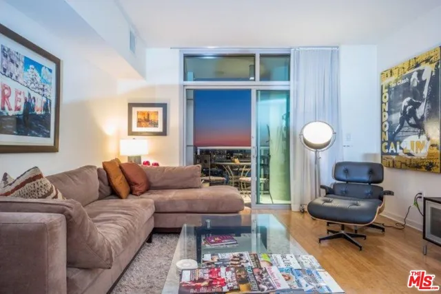 a living room with furniture and a rug