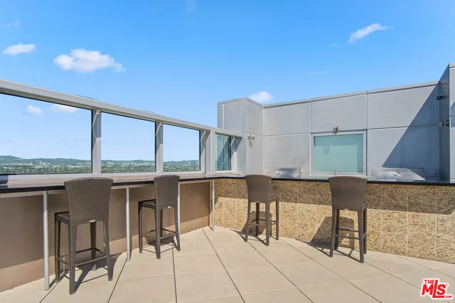 a view of balcony with furniture