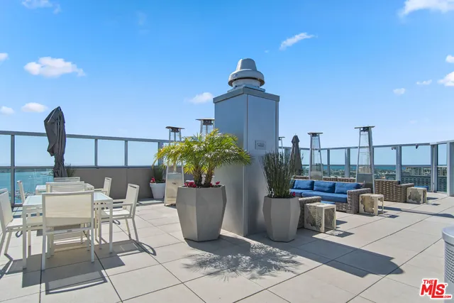a view of a terrace with furniture and potted plants