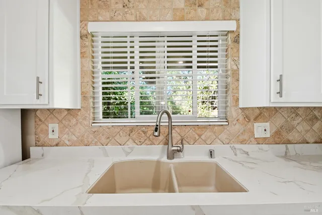a bathroom with a bathtub and window