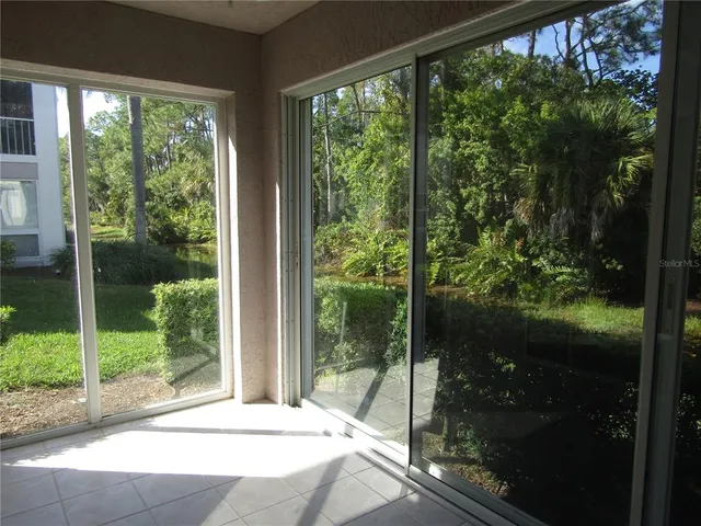 a view of a glass door and porch