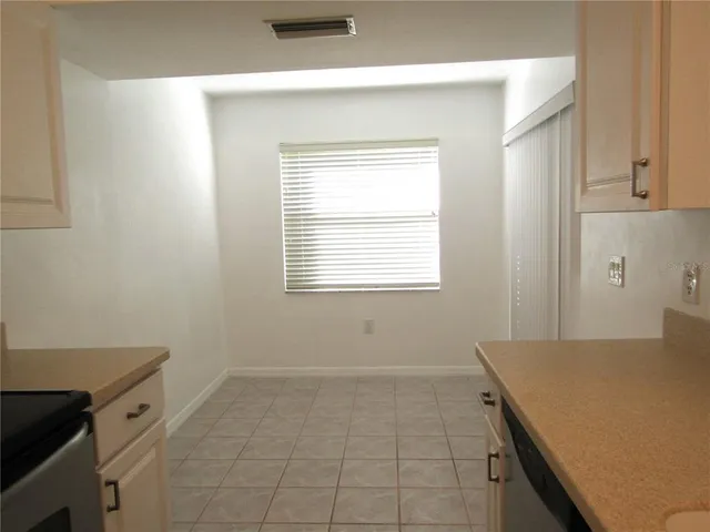 a kitchen with a stove and a refrigerator