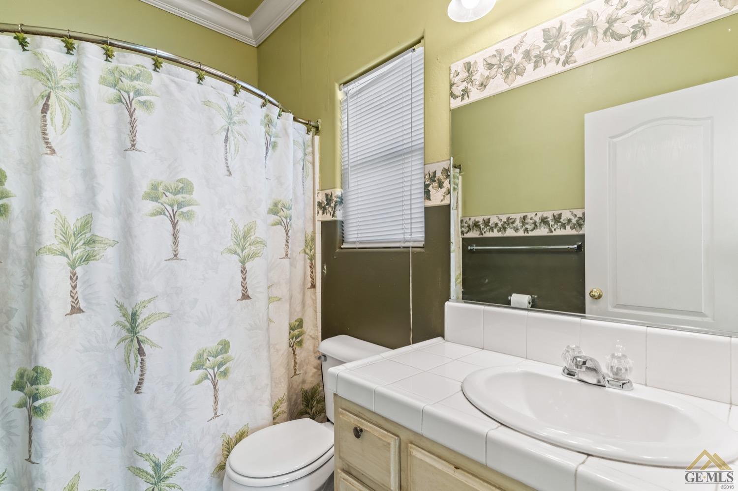 Undisclosed Address Bakersfield, CA 93306 - Photo 15 of 28 a bathroom with a sink toilet and shower