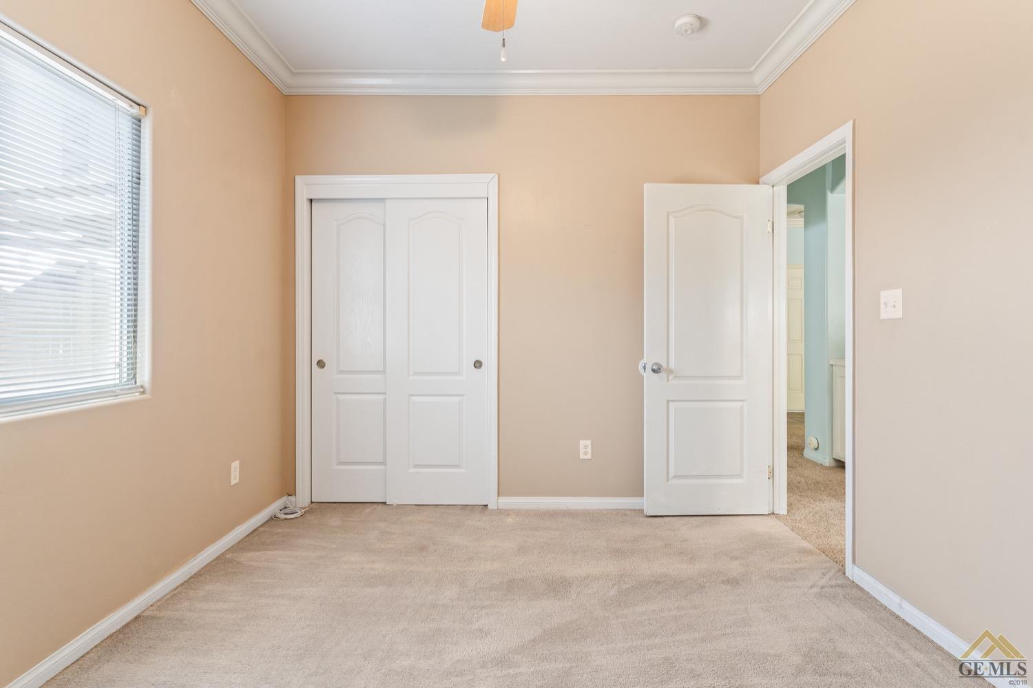 Undisclosed Address Bakersfield, CA 93306 - Photo 19 of 28 an empty room with windows and closet