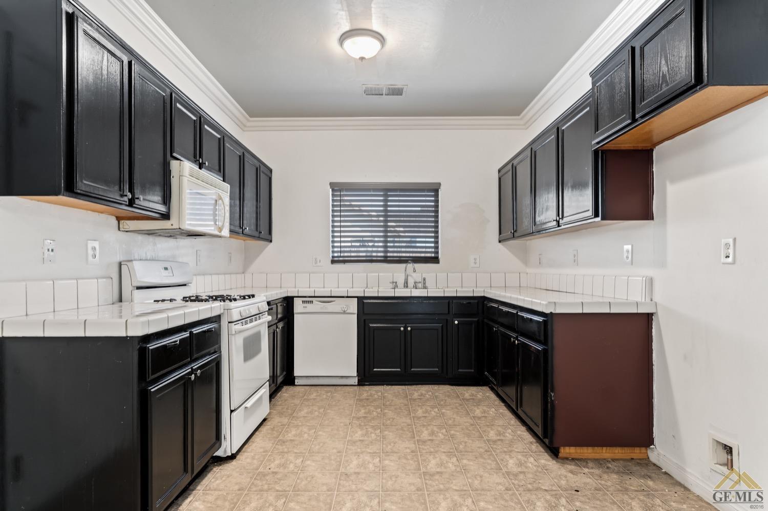Undisclosed Address Bakersfield, CA 93306 - Photo 7 of 28 a kitchen with stainless steel appliances granite countertop a sink and stove top oven