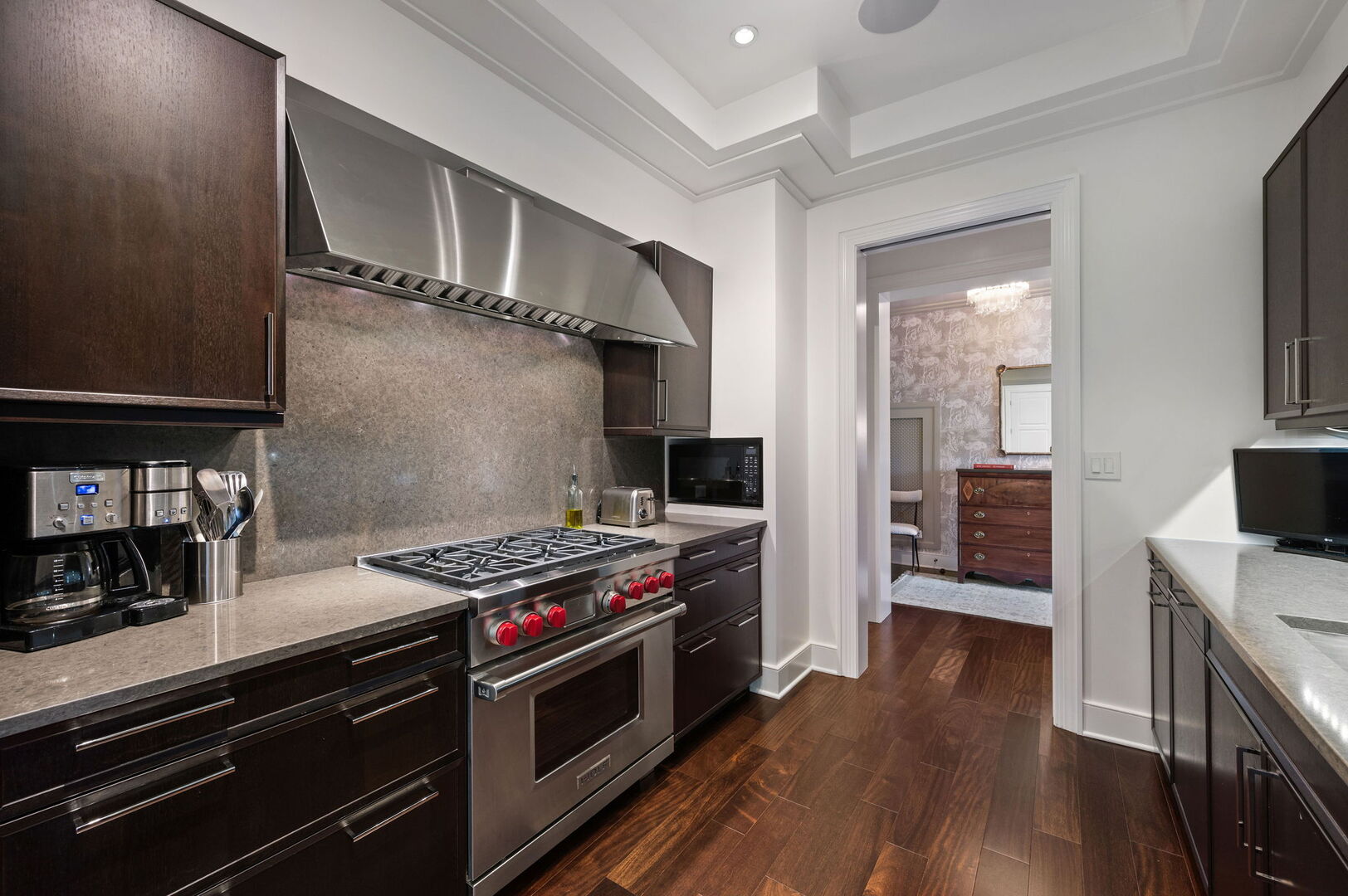 118 East Erie Street, Unit 28F Chicago, IL 60611 - Photo 12 of 31 a kitchen with stainless steel appliances a stove a sink and a refrigerator