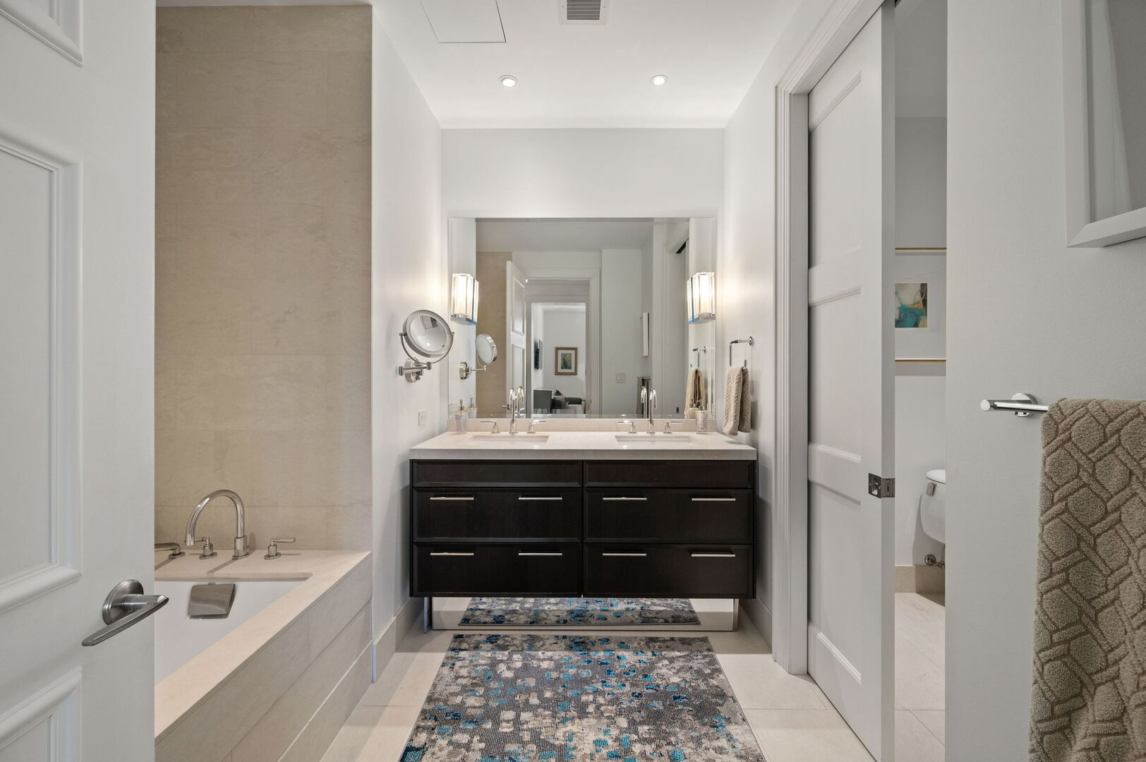 118 East Erie Street, Unit 28F Chicago, IL 60611 - Photo 16 of 31 a bathroom with a bathtub and a sink