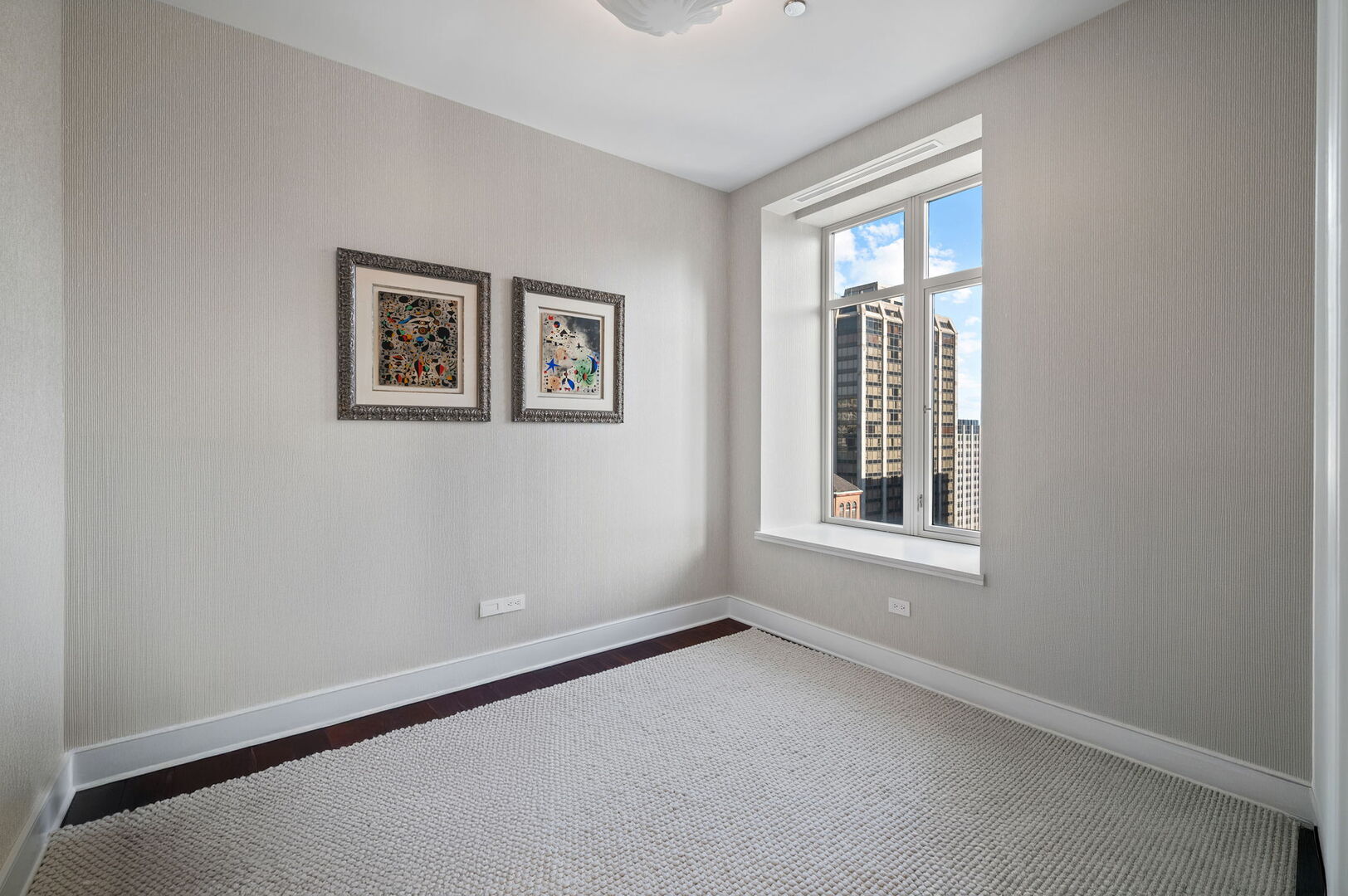 118 East Erie Street, Unit 28F Chicago, IL 60611 - Photo 18 of 31 an empty room with windows