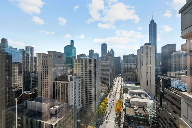 a living room with furniture and large windows