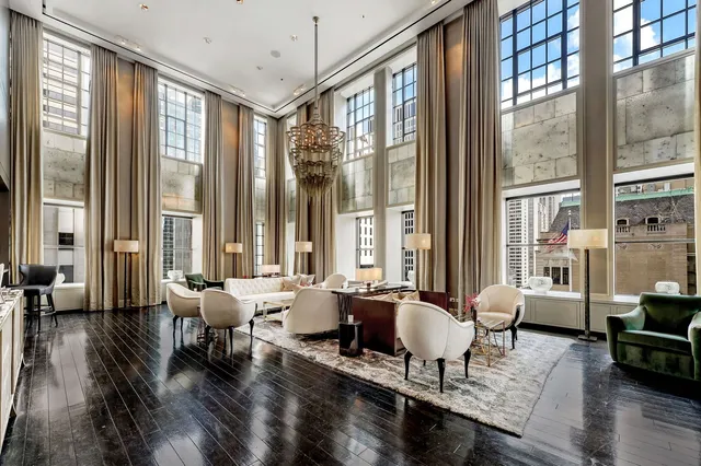 a projector room with furniture projector screen and screen